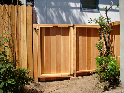 Back yard solid face wood fence and gate
